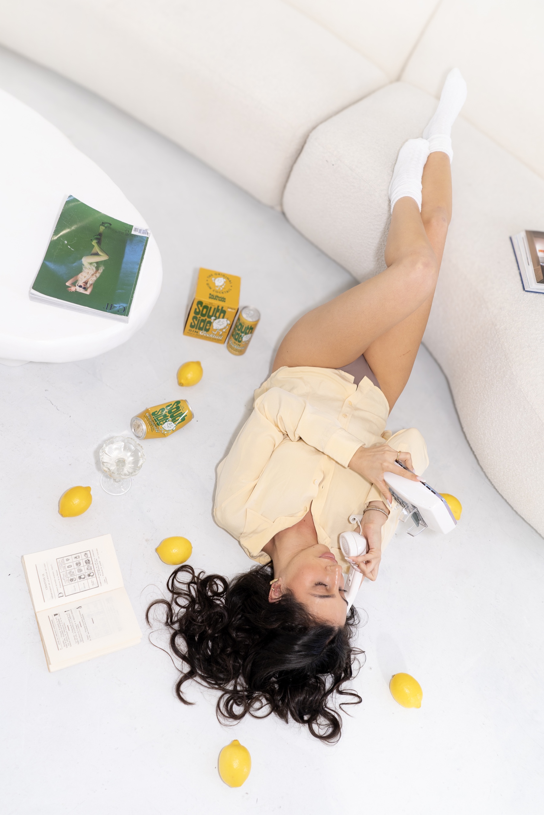 Overhead editorial portrait of Isadora surrounded by lemons